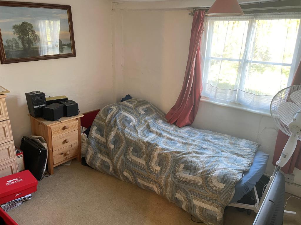 Lot: 11 - CHARACTER COTTAGE IN NEED OF IMPROVEMENT - Bedroom with window overlooking rear of property